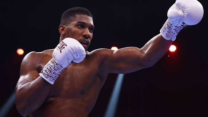Anthony Joshua taunts during the Heavyweight fight between him and Otto Wallin during the Day of Reckoning in Riyadh, Saudi Arabia. Joshua says he has agreed to fight Tyson Fury and Deontay Wilder in the past, so he won't back down. RICHARD PELHAM/GETTY IMAGES.
